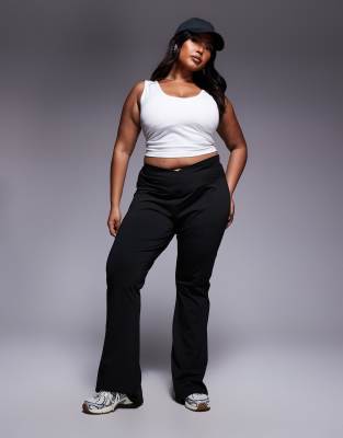 ASOS DESIGN Curve high waist sculpting cross front flare pants in black - view 1