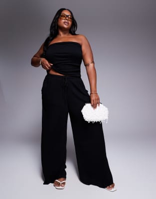 ASOS DESIGN Curve - Hose mit Knitterstruktur, weitem Bein und Kordelzugbund-Schwarz