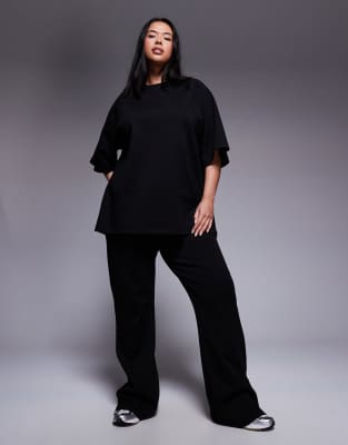 ASOS DESIGN Curve interlock flared trackies in black (part of a set) - view 1