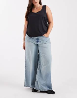 ASOS DESIGN Curve - Jean ample à taille haute - Délavage vintage-Bleu