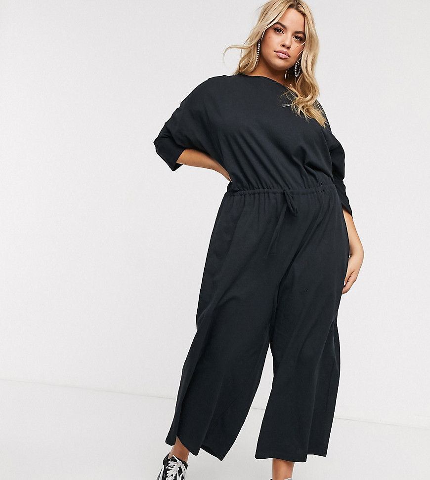 ASOS DESIGN - Curve - Jersey jumpsuit met strikceintuur in zwart