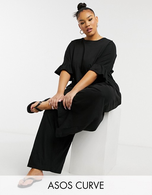 ASOS DESIGN curve jersey smock jumpsuit with frill sleeve in black