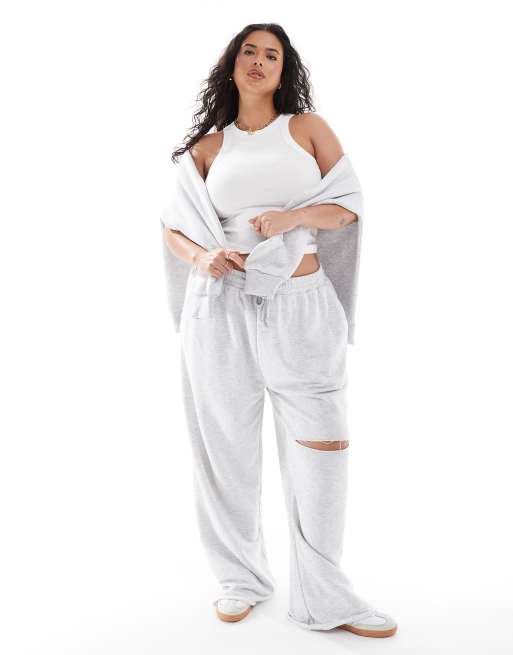 ASOS DESIGN Curve - Joggers a fondo ampio grigio mélange con strappo sul ginocchio