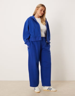 ASOS DESIGN Curve - Jogginghose in Tiefblau, mit weicher Innenseite und weitem, abgerundetem Bein