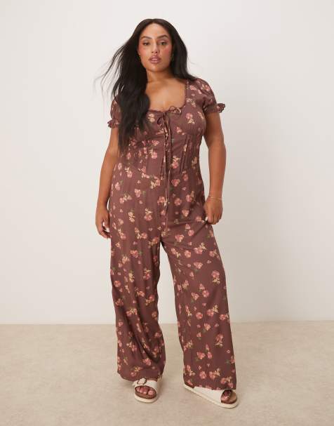 ASOS DESIGN Curve – Jumpsuit in Malve mit Blumenmuster, gesponnener Spitze und Korsetttaille - view 1