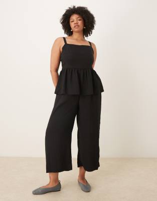 ASOS DESIGN Curve - Jumpsuit in Schwarz mit Schößchen-Taille