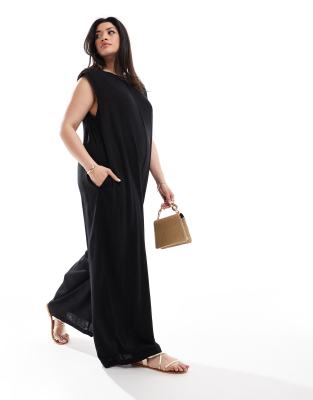 ASOS DESIGN Curve - Jumpsuit in Schwarz mit weitem Bein, Schulterpolstern und geradem Schnitt