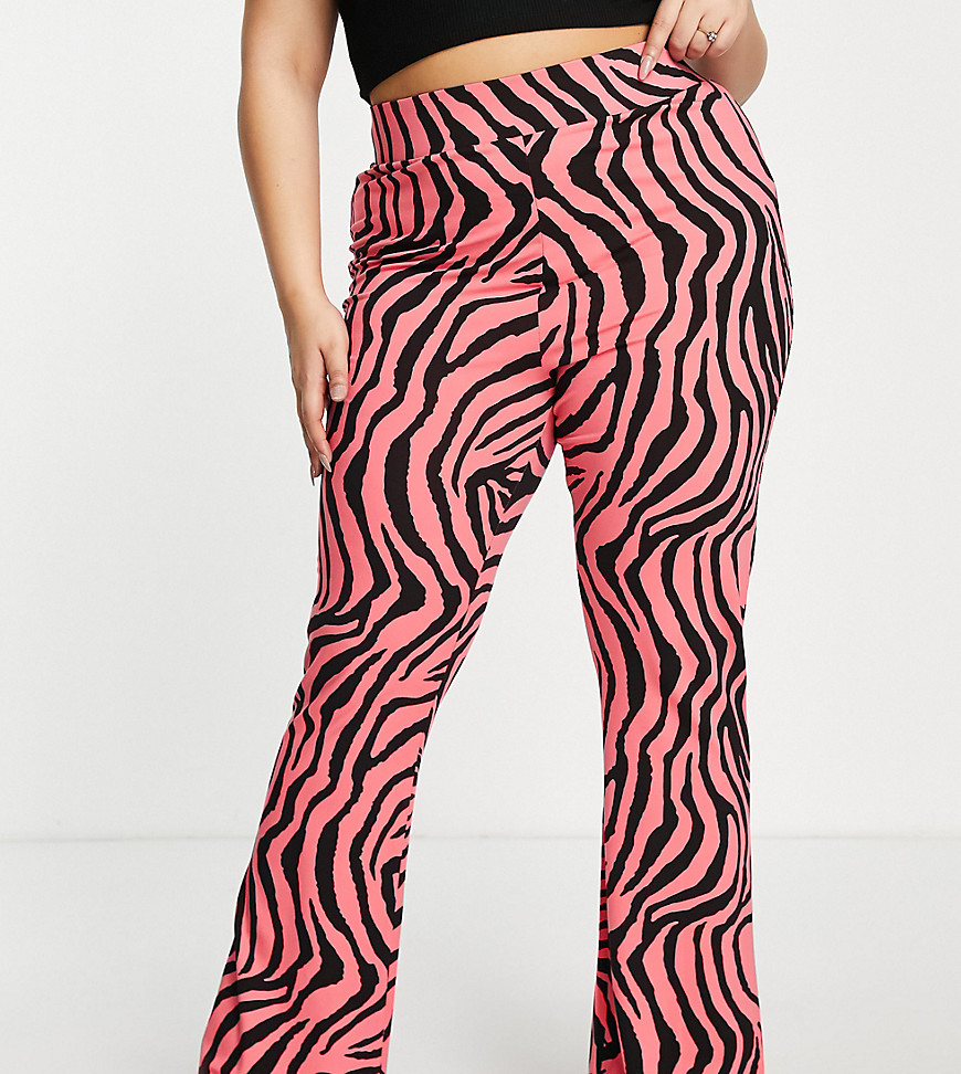 Plus-size trousers by ASOS DESIGN Just as bold IRL All-over animal print High rise Elasticated waist Flared slim fit