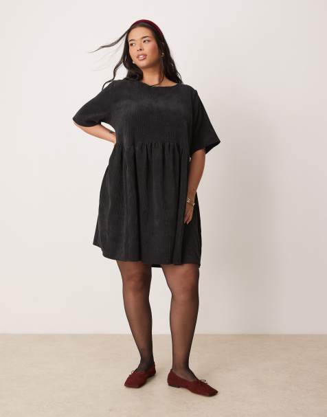 ASOS DESIGN Curve – Kurzes T-Shirt-Hängerkleid aus Cord in Schwarz mit Ziernaht in der Taille - view 1