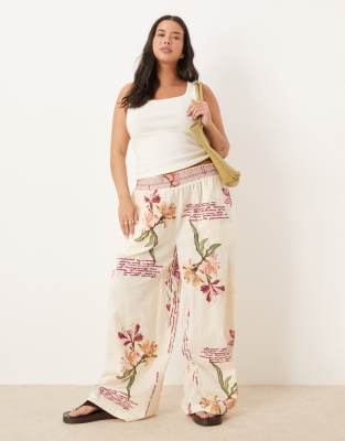 ASOS Curve ASOS DESIGN Curve linen blend pull on wide leg trousers with shirred waist detail in floral print-Multi