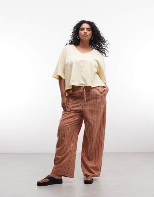 ASOS DESIGN Curve linen look pull on pants in orange stripes