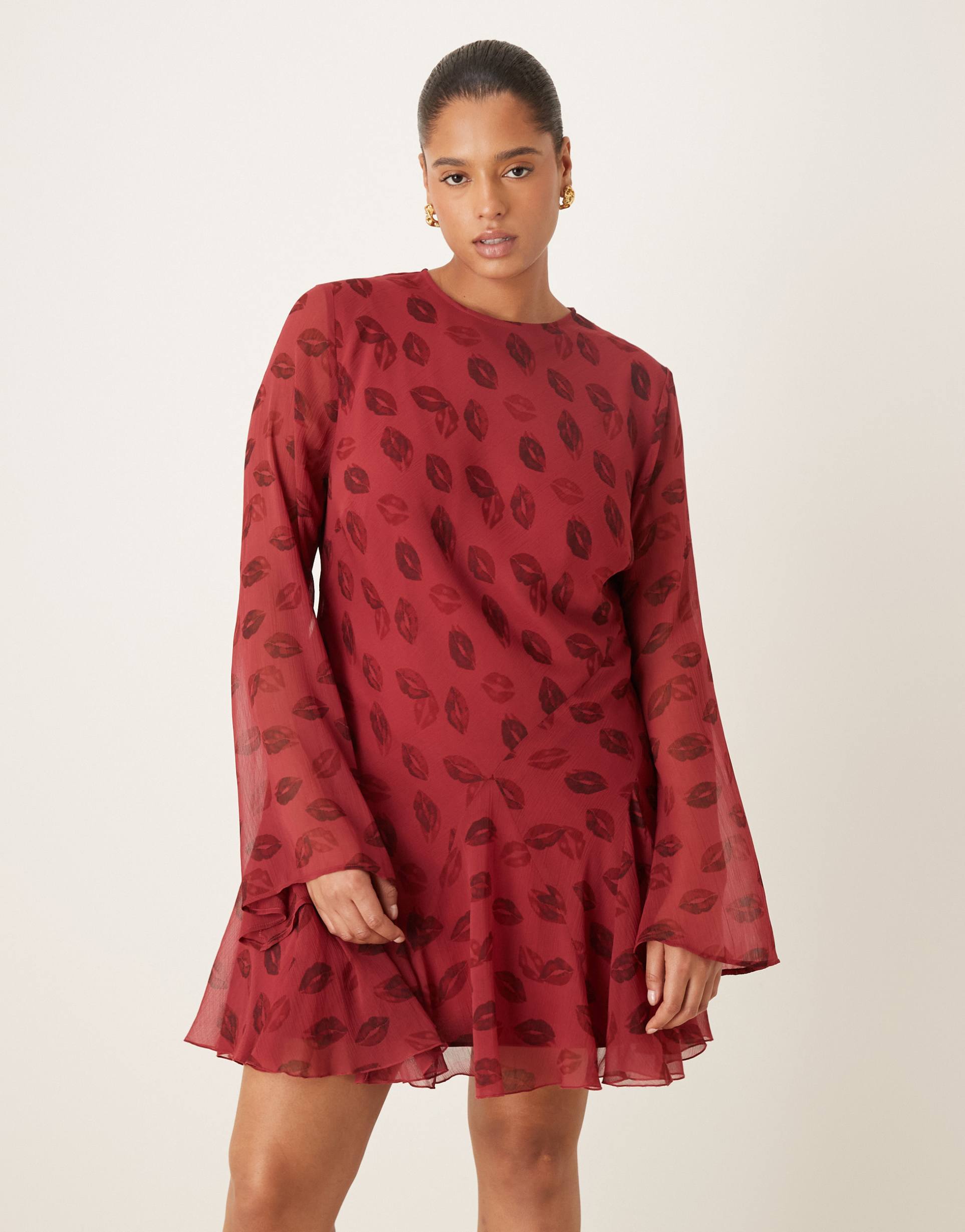asos design curve long sleeve mini dress with ruffle skirt in red lip print