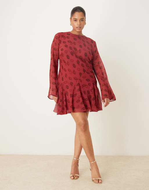 ASOS DESIGN Curve long sleeve mini dress with ruffle skirt in red lip print, 2 of 4