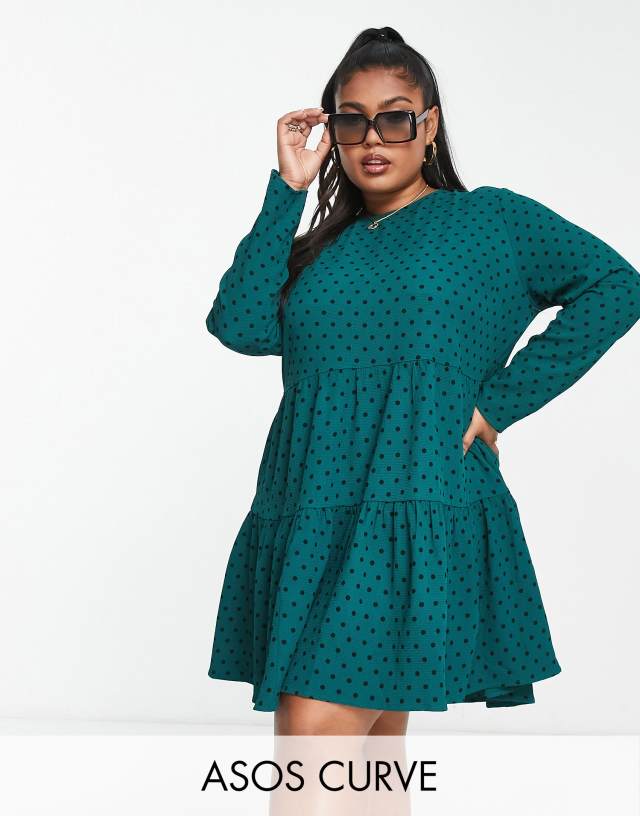 ASOS DESIGN Curve long sleeve tiered smock mini dress in bottle green spot