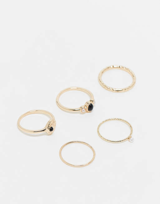 ASOS DESIGN Curve - Lot de 5 bagues avec pierre noire et perles fantaisie - Doré