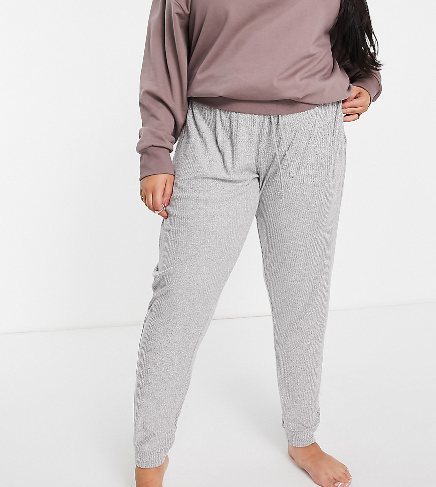Plus-size joggers by ASOS DESIGN Dressed to chill Elasticated drawstring waist Side pockets Fitted cuffs Regular, tapered fit