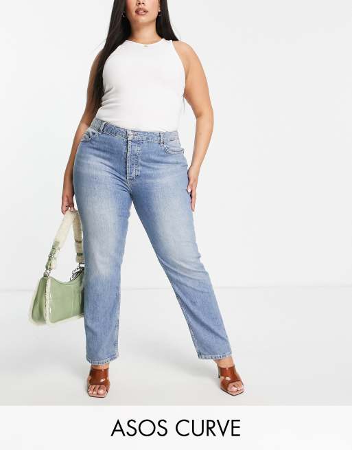 ASOS DESIGN mid rise comfort stretch straight leg jeans in midwash