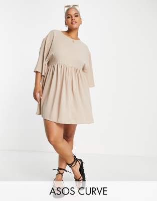 Plus-size dress by ASOS DESIGN Add-to-bag material Round neck Drop shoulders Cut-out back with tie detail Regular fit