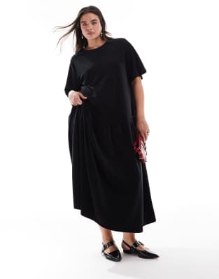 ASOS DESIGN Curve - Minikleid aus dickem Cord in Schwarz mit ausgestelltem Saum und Bindeband am Rücken