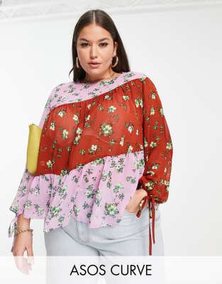 Plus-sized b louse by ASOS DESIGN We see this blouse in your future Colour-block design All-over floral print Round neck Tie cuffs Tie-keyhole back Regular fit