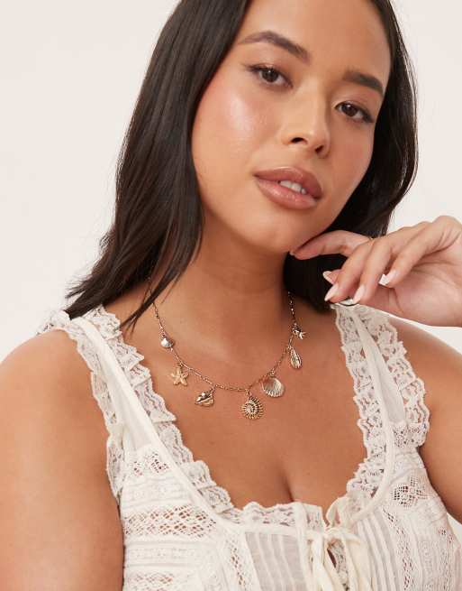 ASOS DESIGN Curve – Naszyjnik w odcieniu złotym z zawieszkami z morskimi motywami