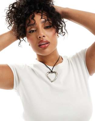 ASOS Curve ASOS DESIGN Curve necklace with cord detail and oversized heart in silver tone