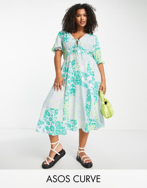 ASOS DESIGN Curve - Nette midi-jurk met gestrikte voorkant, godet-plooitjes en gemengde print in groen en lila