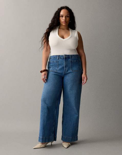 ASOS DESIGN Curve high waist wide leg jeans with front pockets in mid blue 