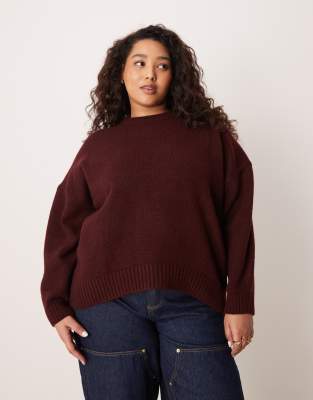 ASOS DESIGN Curve - Oversize-Pullover in Pflaume mit Rundhalsausschnitt und geschwungenem Saum-Lila