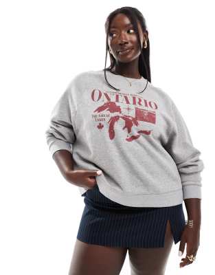 ASOS DESIGN Curve - Oversize-Sweatshirt in Grau meliert mit „Ontario"-Grafik und Raglanärmeln