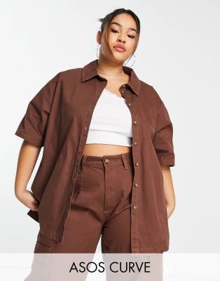Tops by ASOS Curve Part of a co-ord set Trousers sold separately Spread collar Button placket Side splits Oversized fit