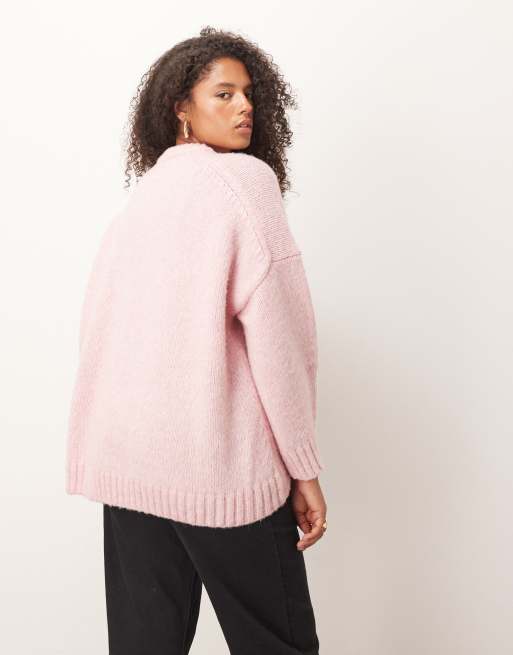 ASOS DESIGN Curve oversized crew neck sweater with curved hem in pink