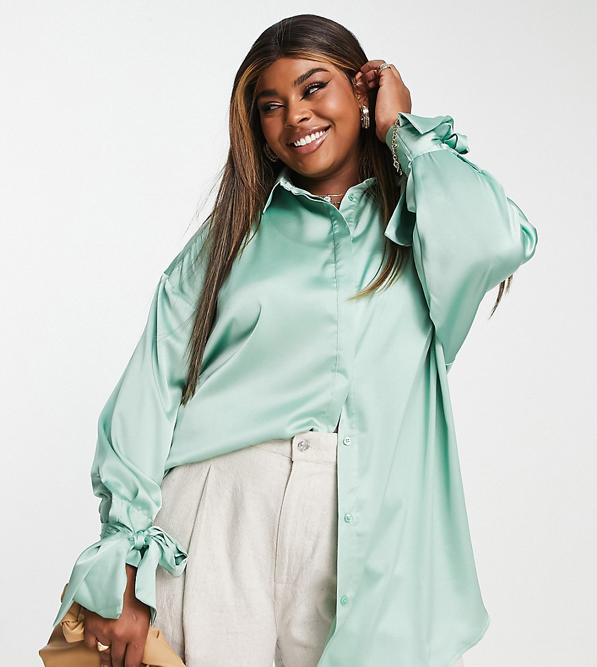 Tops by ASOS Curve Next stop: checkout Spread collar Button placket Tie cuffs Oversized fit