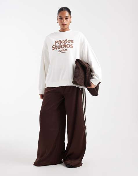 ASOS DESIGN Curve oversized sweatshirt with pilates studio graphic in cream - view 1