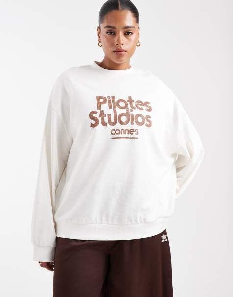 ASOS DESIGN Curve oversized sweatshirt with pilates studio graphic in cream