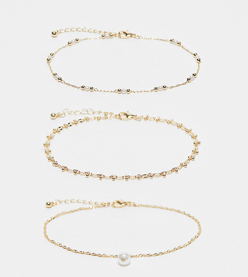 ASOS DESIGN Curve pack of 3 anklets with faux pearl and ball design in gold tone
