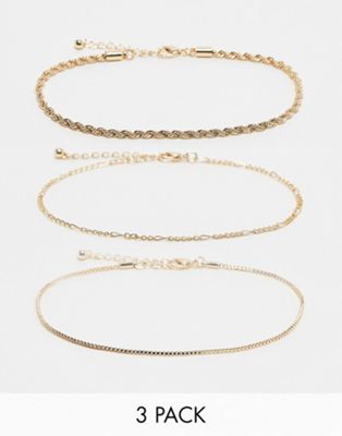 ASOS DESIGN Curve pack of 3 anklets with mixed chain design in gold tone