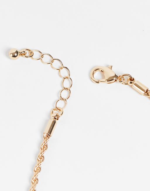 ASOS DESIGN Curve pack of 4 fine chain bracelets in gold tone