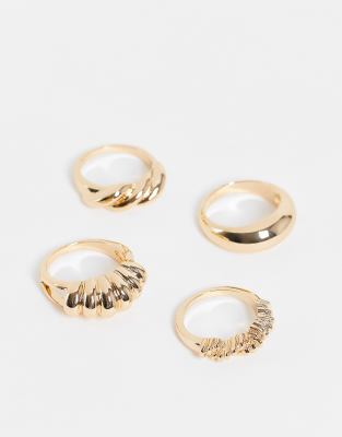 ASOS DESIGN Curve pack of 4 rings in twist design in gold tone