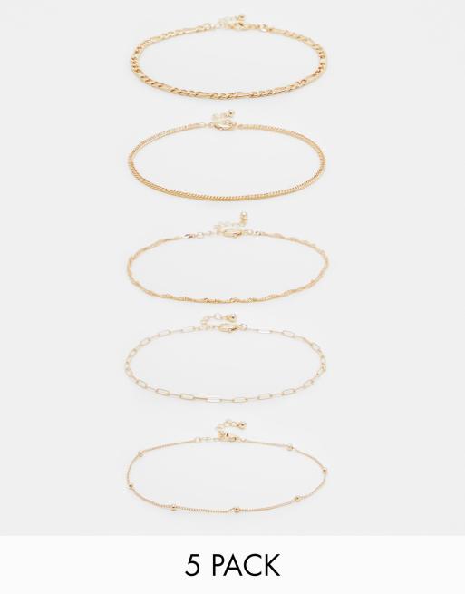ASOS DESIGN Curve pack of 5 anklets with mixed design in gold tone