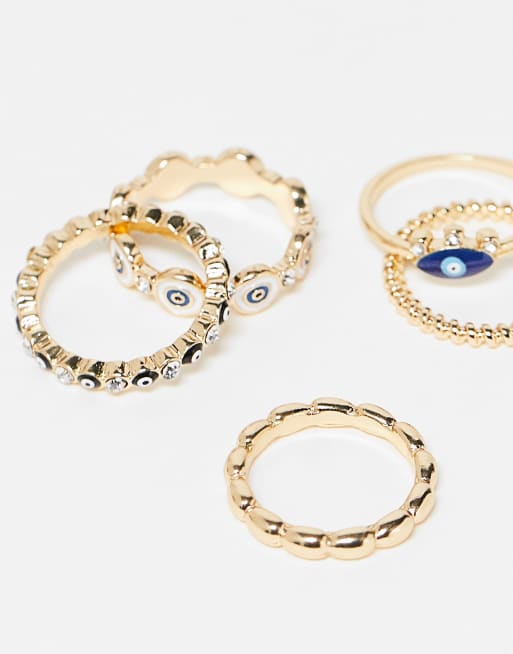 ASOS DESIGN Curve pack of 5 rings with mixed eye design in gold tone, 3 of 4
