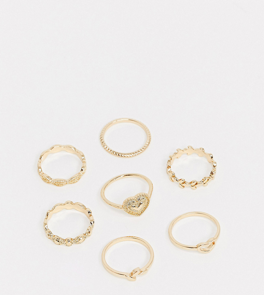 ASOS DESIGN Curve pack of 7 rings with mixed texture designs in gold tone