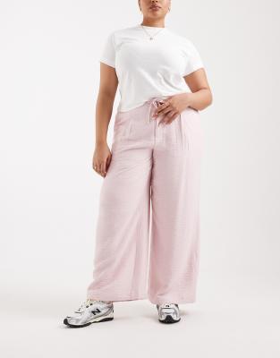 ASOS DESIGN Curve - Pantalon ample en tissu texturé doux au toucher - Rose 50