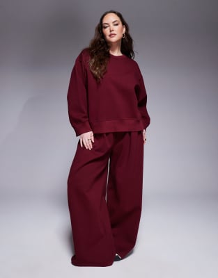 ASOS DESIGN Curve - Pantaloni a fondo super ampio in tessuto interlock bordeaux in coordinato - view 1