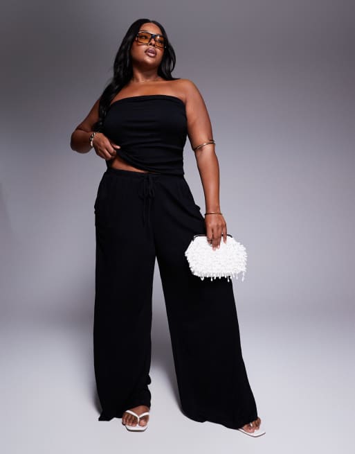 ASOS DESIGN Curve - Pantaloni allacciati in vita a fondo ampio in tessuto stropicciato
