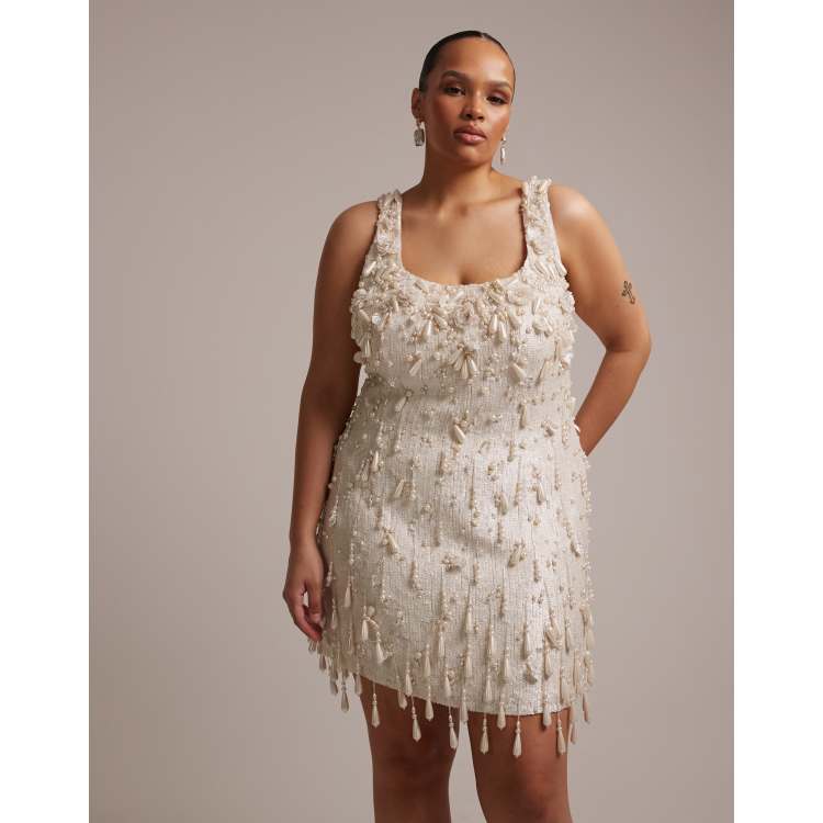 asos design structured mini dress with pearl embellishment ASOS DESIGN structured mini dress with wrap skirt and pearl embellishment
