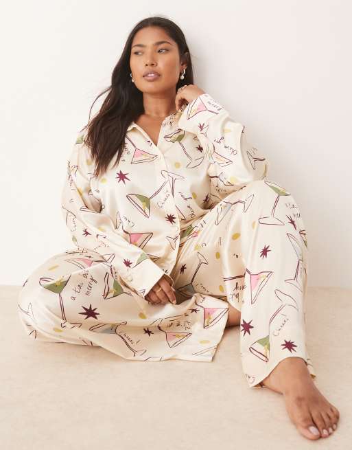 ASOS DESIGN Curve - Pigiama con camicia e pantaloni in raso con stampa cocktail