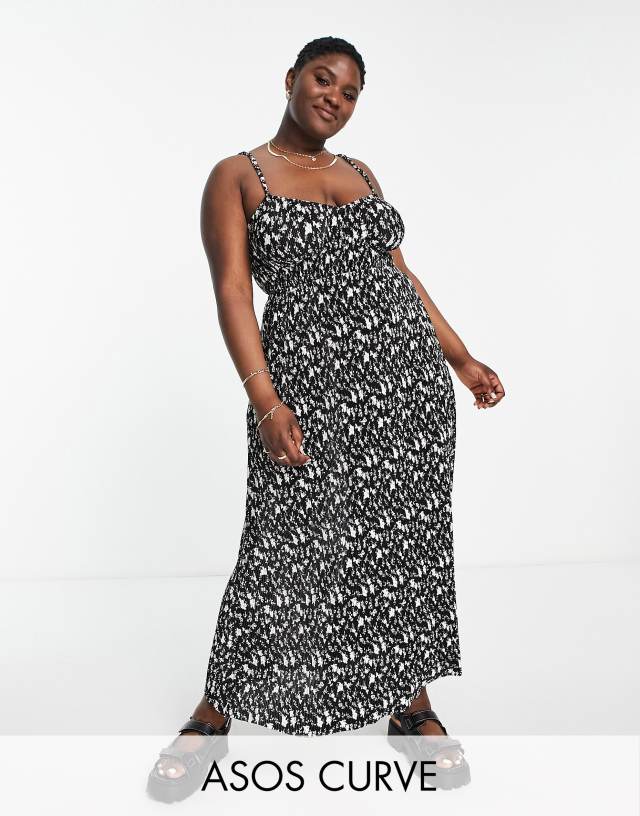 ASOS Curve - ASOS DESIGN Curve plisse strappy maxi dress in black and white ditsy floral