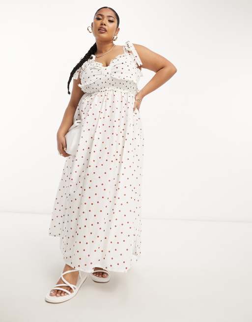 ASOS DESIGN Curve - Polkaprikket midi-sundress med sløjfedesign over brystet og smock-syninger i taljen i brun 