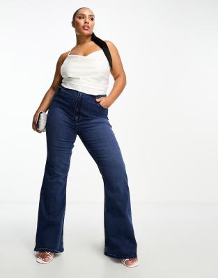 ASOS DESIGN Curve - Powerstretch-Jeans in Dunkelblau mit ausgestelltem Bein